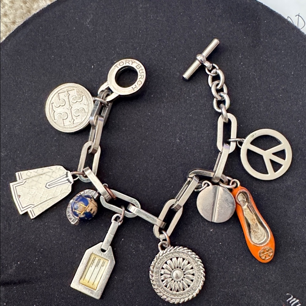 Rare Tory Burch silver charm bracelet 692/1000 pieces. no dust bag/box. Thanks!